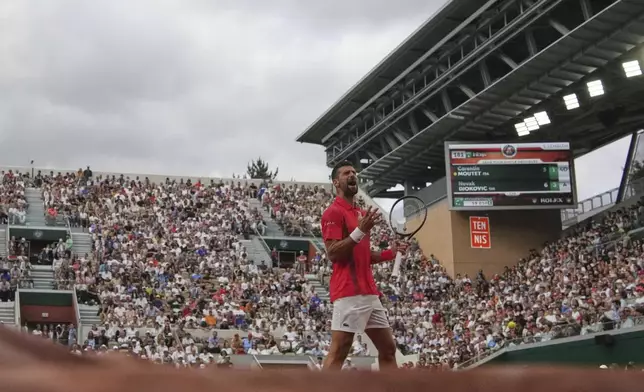 Serbia's Novak Djokovic reacts as he plays France's Corentin Moutet during their second round match of the French Tennis Open, at the Roland-Garros stadium, in Paris, Thursday, May 29, 2025. (AP Photo/Christophe Ena)
