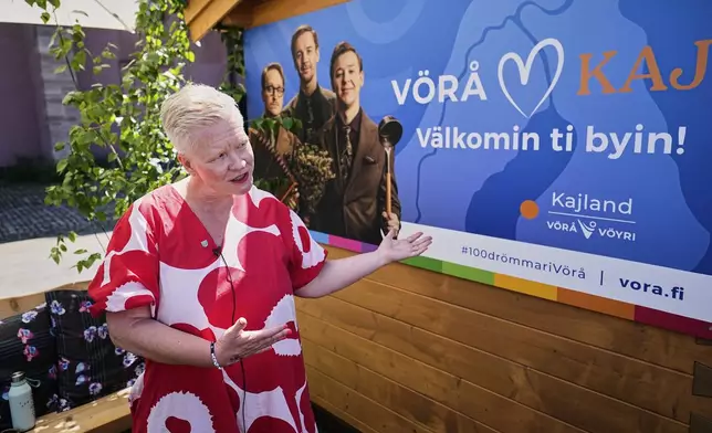 Organizer Dorothee Schulte-Basta talks to the Associated Press in front of a Finnish pop-up sauna promoting the Swedish Eurovision competitor KAJ from Finland during the 69th Eurovision Song Contest week, in Basel, Switzerland, Wednesday, May 14, 2025. (AP Photo/Martin Meissner)
