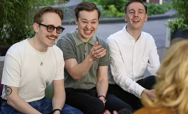 Swedish Eurovision contestants KAJ from Finland, Kevin Holmstrom, Jakob Norrgard and Axel Ahman, from right, give an interview with the Associated Press during the 69th Eurovision Song Contest week, in Basel, Switzerland, Thursday, May 15, 2025. (AP Photo/Martin Meissner)