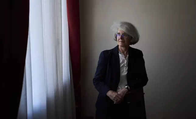 Sister Nathalie Becquart walks inside the General Secretariat of the Synod in Rome on Saturday, May 10, 2025. (AP Photo/Bernat Armangue)