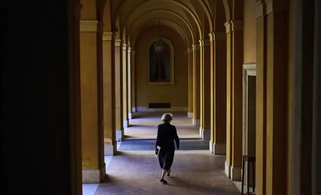 Sister Nathalie Becquart walks inside the General Secretariat of the Synod in Rome on Saturday, May 10, 2025. (AP Photo/Bernat Armangue)