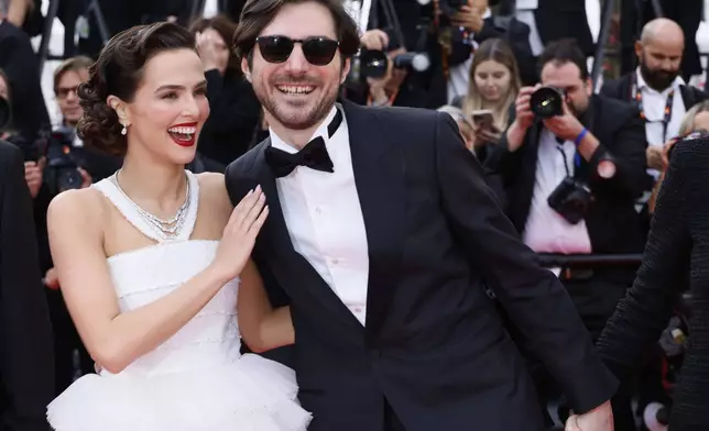 Zoey Deutch, left, and Guillaume Marbeck pose for photographers upon arrival at the premiere of the film 'Nouvelle Vague' at the 78th international film festival, Cannes, southern France, Saturday, May 17, 2025. (Photo by Joel C Ryan/Invision/AP)