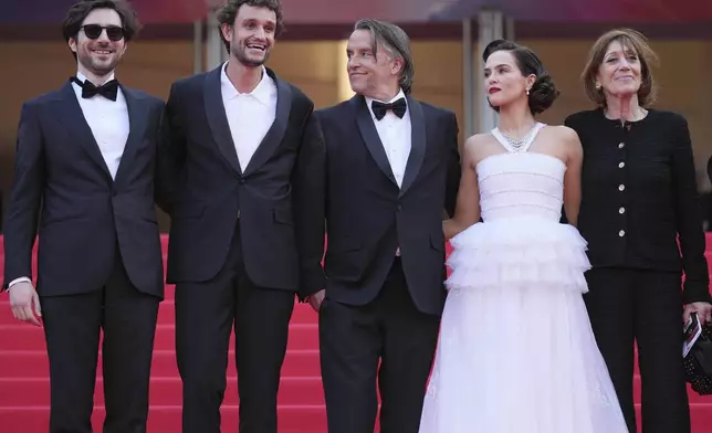 Guillaume Marbeck, from left, Aubry Dullin, director Richard Linklater, Zoey Deutch and Michele Halberstadt pose for photographers upon arrival at the premiere of the film 'Nouvelle Vague' at the 78th international film festival, Cannes, southern France, Saturday, May 17, 2025. (AP Photo/Natacha Pisarenko)