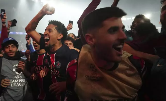 PSG players celebrate after the Champions League semifinal, second leg soccer match between Paris Saint-Germain and Arsenal at the Parc des Princes in Paris, Wednesday, May 7, 2025. (AP Photo/Thibault Camus)