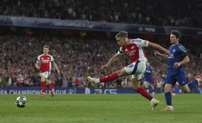 Arsenal's Leandro Trossard attempts a shot at goal and saved by PSG's goalkeeper Gianluigi Donnarumma during the Champions League semifinal first leg soccer match between Arsenal and Paris Saint-Germain at Emirates Stadium in London, England, Tuesday, April 29, 2025. (AP Photo/Kirsty Wigglesworth)