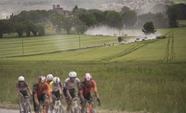 Cycles in the lead breakaway during the stage 9 of the Giro d'Italia from Gubbio to Siena, Italy, Sunday, May 18, 2025. (Marco Alpozzi/Lapresse via AP)