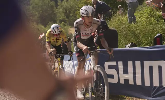 Wout Van Aert and Romero Del Toro during the stage 9 of the Giro d'Italia from Gubbio to Siena, Italy, Sunday, May 18, 2025. (Marco Alpozzi/Lapresse via AP)