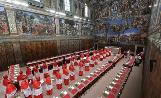 Cardinals arrive to attend the first day of the conclave to elect the successor of late Pope Francis inside the Sistine Chapel at the Vatican, Wednesday, May 7, 2025. (Vatican Media via AP)