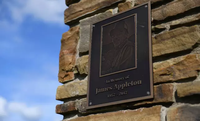 A plaque honoring water department employee James Appleton, who was fatally shot in 2017, hangs at the entrance of Gateway City Park in Gateway, Ark. on May 28, 2026. (AP Photo/Nick Ingram)
