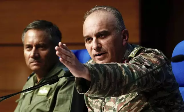 Director General of Military Operations Lt. Gen. Rajiv Ghai, right, speaks to the media at a press conference as Air Marshal AK Bharti looks on, in New Delhi, Sunday, May 11, 2025. (AP Photo/Manish Swarup)