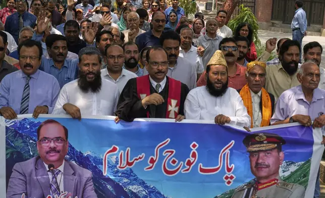 People from Christian and Muslim communities hold a demonstration to show their support with Pakistan Army, a day after the ceasefire between Indian and Pakistan, in Lahore, Pakistan, Sunday, May 11, 2025. (AP Photo/K.M. Chaduary)