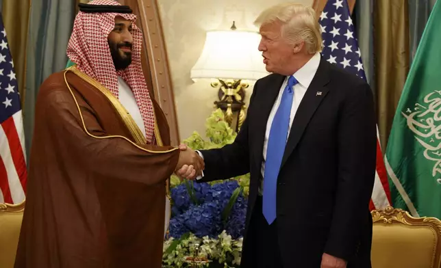 FILE- President Donald Trump, right, shakes hands with Saudi Deputy Crown Prince and Defense Minister Mohammed bin Salman during a bilateral meeting, in Riyadh, May 20, 2017. (AP Photo/Evan Vucci, File)