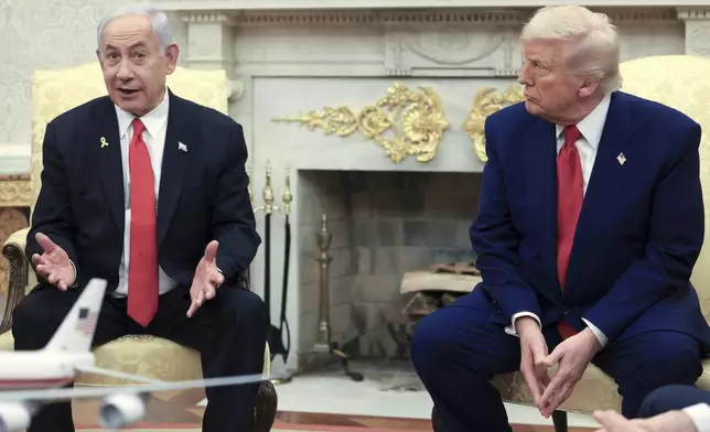 FILE - President Donald Trump, right, listens as Israel's Prime Minister Benjamin Netanyahu speaks during a meeting in the Oval Office at the White House in Washington, April 7, 2025. (Pool via AP, file)