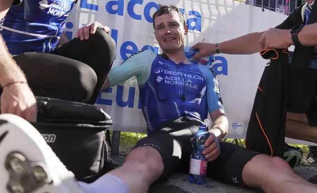 France's Nicolas Prodhomme of Decathlon Ag2R La Mondiale Team reacts after crossing the finish line to win the 19th stage of the Giro d'Italia cycling race, from Biella to Champoluc, Italy, Friday, May 30, 2025. (Gian Mattia D'Alberto/LaPresse via AP)