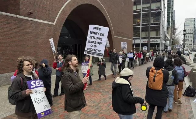 FILE - Protesters gather outside federal court during a hearing for Rumeysa Ozturk, a Tufts University doctoral student from Turkey who was detained by immigration authorities, April 3, 2025, in Boston. (AP Photo/Rodrique Ngowi, File)