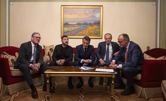 From left, British Prime Minister Keir Starmer, President Volodymyr Zelenskyy, French President Emmanuel Macron, Polish Prime Minister Donald Tusk and German Chancellor Friedrich Merz make a call to U.S. President Donald Trump from Kyiv, Ukraine, on Saturday, May 10, 2025. (AP Photo/Mstyslav Chernov)