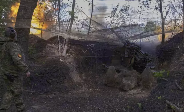 Ukrainian servicemen of the 127th Territorial Defence Brigade fire KS-19 100mm gun towards Russian positions near Kharkiv, Ukraine, Friday, May 16, 2025. (AP Photo/Yevhen Titov)