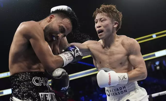 Naoya Inoue hits Ramon Cardenas in a junior featherweight title boxing match Sunday, May 4, 2025, in Las Vegas. (AP Photo/John Locher)