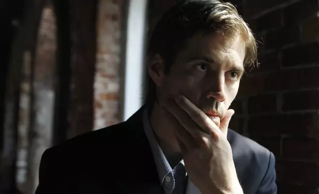 FILE - Journalist James Foley responds to questions during an interview with The Associated Press, in Boston, May 27, 2011. (AP Photo/Steven Senne, File)