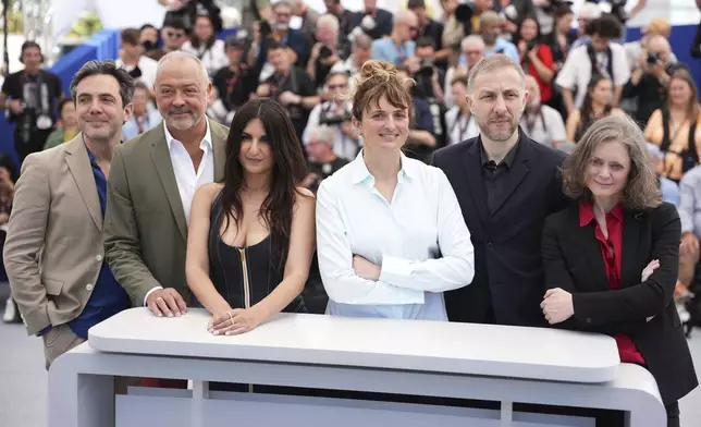 Jury president Alice Rohrwacher, second from left, and jury members Frederic Mercier, Tommaso Vergallo, Geraldine Nakache, Rachid Hami, and Pascale Marin pose for photographers at the photo call for the Camera d'Or jury at the 78th international film festival, Cannes, southern France, Wednesday, May 14, 2025. (Photo by Scott A Garfitt/Invision/AP)
