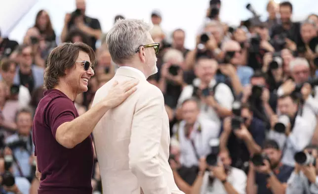 Tom Cruise, left and director Christopher McQuarrie pose for photographers during the photo call for the film 'Mission: Impossible – The Final Reckoning' at the 78th international film festival, Cannes, southern France, Wednesday, May 14, 2025. (Photo by Scott A Garfitt/Invision/AP)