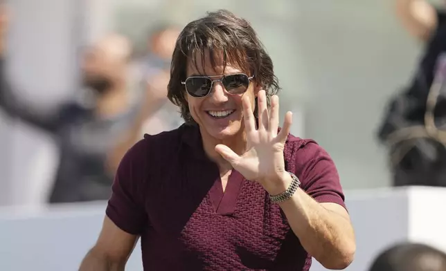 Tom Cruise arrives for the photo call for the film 'Mission: Impossible – The Final Reckoning' at the 78th international film festival, Cannes, southern France, Wednesday, May 14, 2025. (AP Photo/Natacha Pisarenko)