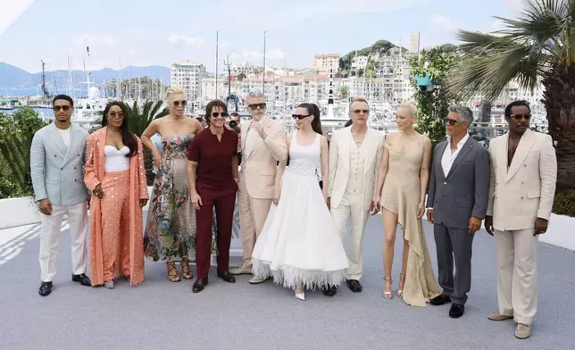 Greg Tarzan Davis, from left, Angela Bassett, Hannah Waddingham, Tom Cruise, director Christopher McQuarrie, Hayley Atwell, Simon Pegg, Pom Klementieff, Esai Morales, and Tramell Tillman pose for photographers during the photo call for the film 'Mission: Impossible – The Final Reckoning' at the 78th international film festival, Cannes, southern France, Wednesday, May 14, 2025. (Photo by Joel C Ryan/Invision/AP)