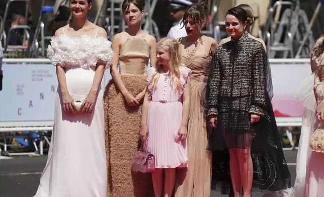 Luise Heyer, from left, Lea Drinda, Hanna Heckt, producer Maren Schmitt, and Lena Urzendowsky pose for photographers upon arrival at the premiere of the film 'Sound of Falling' at the 78th international film festival, Cannes, southern France, Wednesday, May 14, 2025. (Photo by Lewis Joly/Invision/AP)