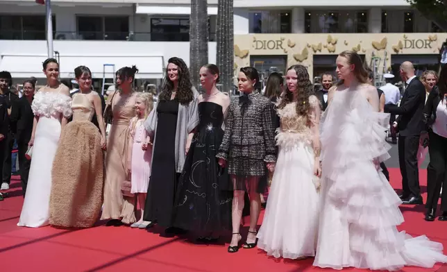 Luise Heyer, from left, Lea Drinda, producer Maren Schmitt, Hanna Heckt, director Mascha Schilinski, Susanne Wust, Lena Urzendowsky, Laeni Geiseler and Luzia Oppermann pose for photographers upon arrival at the premiere of the film 'Sound of Falling' at the 78th international film festival, Cannes, southern France, Wednesday, May 14, 2025. (Photo by Lewis Joly/Invision/AP)