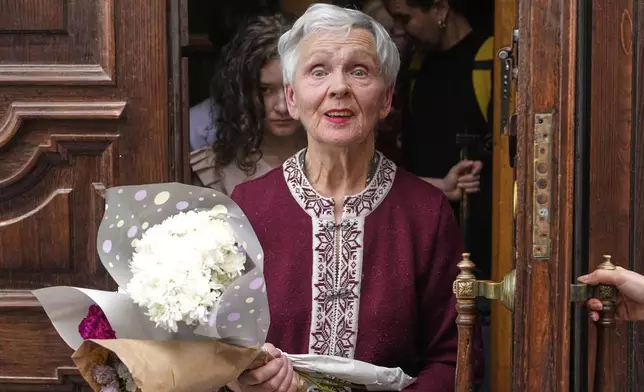 World War II Leningrad siege survivor Lyudmila Vasilyeva, 84, exits a courthouse in St. Petersburg, Russia, Friday, May 23, 2025, following her hearing on charges of discrediting the Russian armed forces after she held a poster calling for an end to military action in Ukraine. (AP Photo/Dmitri Lovetsky)