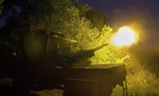 In this photo provided by Ukraine's 127th Separate Brigade of the Territorial Defence press service, soldiers fire during Russian drones attacks near Kharkiv, Ukraine, Saturday, May 24, 2025, (Anatolii Lysianskyi/Ukraine's 127th Separate Brigade via AP)