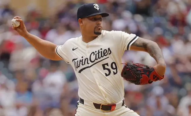 Minnesota Twins relief pitcher Jhoan Duran throws to the Kansas City Royals in the 10th inning of a baseball game Sunday, May 25, 2025, in Minneapolis. (AP Photo/Bruce Kluckhohn)