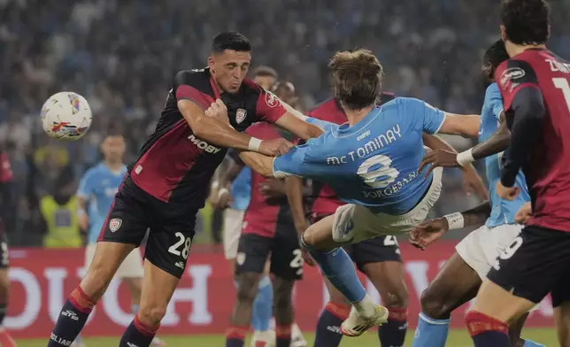 Napoli's Scott McTominay scores his side's first goal during the Italian Serie A soccer match between Napoli and Cagliari at the Diego Maradona stadium in Naples, Italy, Friday, May 23, 2025. (AP Photo/Gregorio Borgia)
