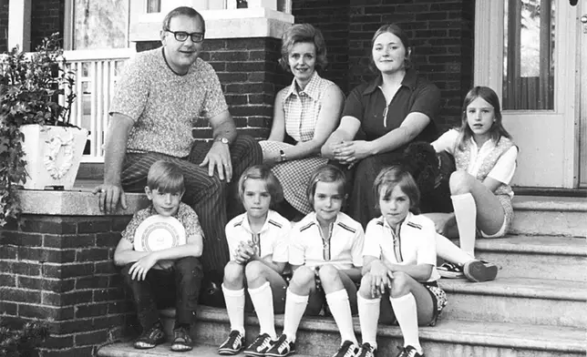 FILE - The Ryan family sits on the porch of their Kankakee, Ill., home in 1970. Back row from left are George; wife, Lura Lynn, and daughters, Nancy and Lynda. Front row are son, George Jr., and triplet daughters Julie, Joanne and Jeanette. (AP Photo/The (Kankakee) Daily Journal, File)