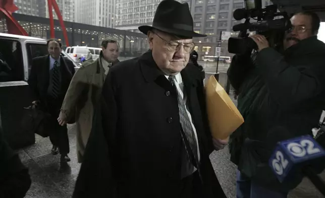 FILE - Former Gov. George Ryan arrives at federal court in Chicago for the first day of final arguments in his racketeering and corruption trial on Monday, March 6, 2006. (AP Photo/M. Spencer Green, File)