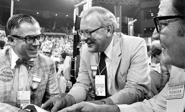 FILE - George Ryan, an Illinois delegate at the 1980 Republican National Convention in Detroit, talks with fellow delegates James Schneider, left, and Chuck Henderson in July 1980. (AP Photo/The (Kankakee) Daily Journal, File)