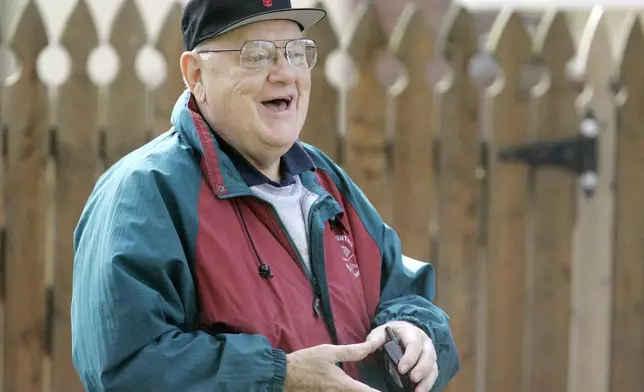 FILE - Former Illinois Gov. George Ryan talks with reporters outside his home in Kankakee, Ill. on Tuesday, Nov. 6, 2007. (AP Photo/M. Spencer Green, File)