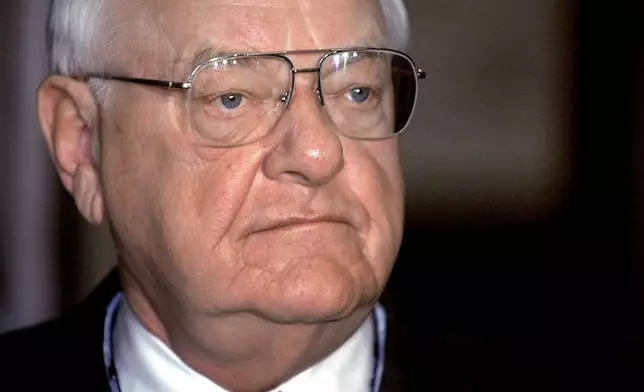 FILE - Gov. George Ryan speaks with reporters at the Capitol in Springfield, Ill, on May 22, 2002. (AP Photo/Seth Perlman)