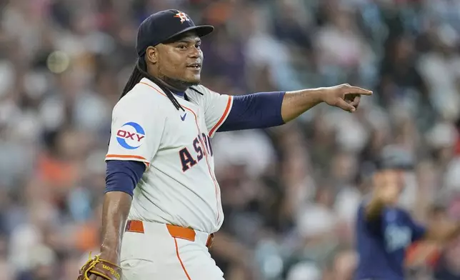 Houston Astros starting pitcher Framber Valdez points to the infield during the sixth inning of a baseball game against the Seattle Mariners Saturday, May 24, 2025, in Houston. (AP Photo/David J. Phillip)
