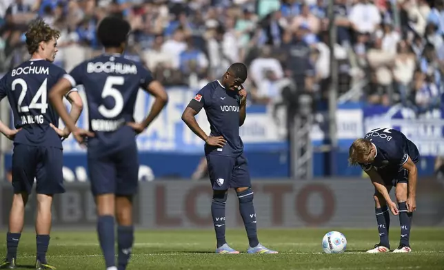 From left, Bochum's Mats Pannewig , Bernardo , Myron Boadu and Dani De Wit during the German Bundesliga soccer match between VfL Bochum and FSV Mainz 05 in Bochum, Germany, Saturday, May 10, 2025. (Anke Waelischmiller/dpa via AP)