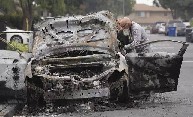 at the site of a plane crash Friday, May 23, 2025, in San Diego. (AP Photo/Gregory Bull)