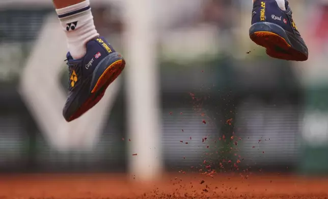 Norway's Casper Ruud is airborne as he serves against Portugal's Nuno Borges during their second round match of the French Tennis Open, at the Roland-Garros stadium, in Paris, Wednesday, May 28, 2025. (AP Photo/Lindsey Wasson)
