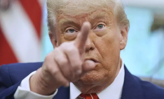 FILE - President Donald Trump gestures as he speaks with reporters in the Oval Office of the White House, May 8, 2025, in Washington. (AP Photo/Evan Vucci, FIle)