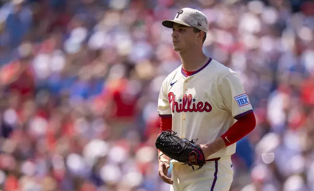 Philadelphia Phillies starting pitcher Mick Abel looks on after getting the final out of the top of the sixth first inning of a baseball game against the Pittsburgh Pirates, Sunday, May 18, 2025, in Philadelphia. (AP Photo/Chris Szagola)