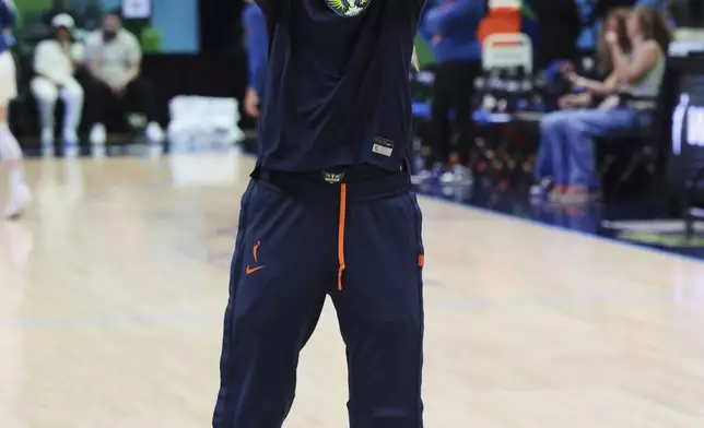 Dallas Wings guard Paige Bueckers warms up before a WNBA basketball game against the Minnesota Lynx, Friday, May 16, 2025, in Arlington, Texas. (AP Photo/Richard Rodriguez)