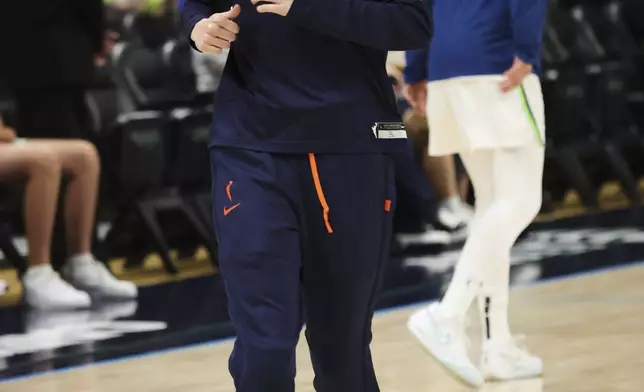 Dallas Wings guard Paige Bueckers warms up before a WNBA basketball game against the Minnesota Lynx, Friday, May 16, 2025, in Arlington, Texas. (AP Photo/Richard Rodriguez)