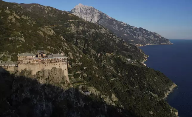 Simonopetra, or the Simonos Petra Monastery, home of the all-male autonomous community Agion Oros, or Holy Mountain, stands on the peninsula of Mount Athos in northern Greece, Sunday, April 13, 2025. (AP Photo/Thanassis Stavrakis)