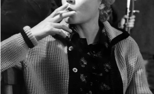 FILE - French actress Simone Signoret smokes a cigarette on a film set in Rome, Italy, May 4, 1960. (AP Photo/Jim Pringle, File)