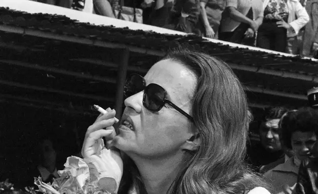 FILE - Jury President Jeanne Moreau smokes a cigarette at the Cannes Film Festival in France on May 12, 1975. (AP Photo, File)