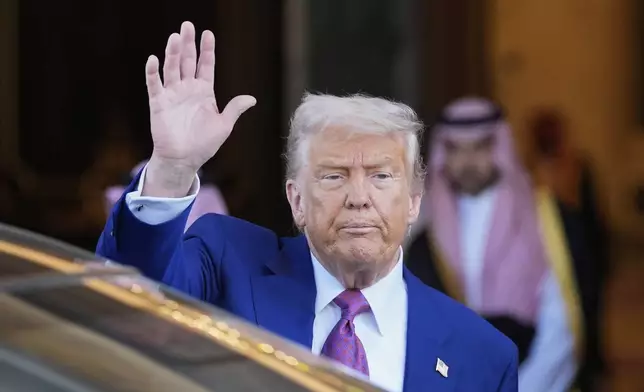 President Donald Trump waves as he leaves the Royal Palace after a signing ceremony with Saudi Crown Prince Mohammed bin Salman in Riyadh, Saudi Arabia, Tuesday, May 13, 2025. (AP Photo/Alex Brandon)